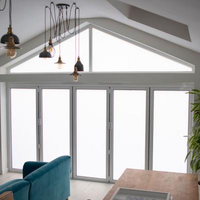 Residential bifold doors in electric privacy glass 
